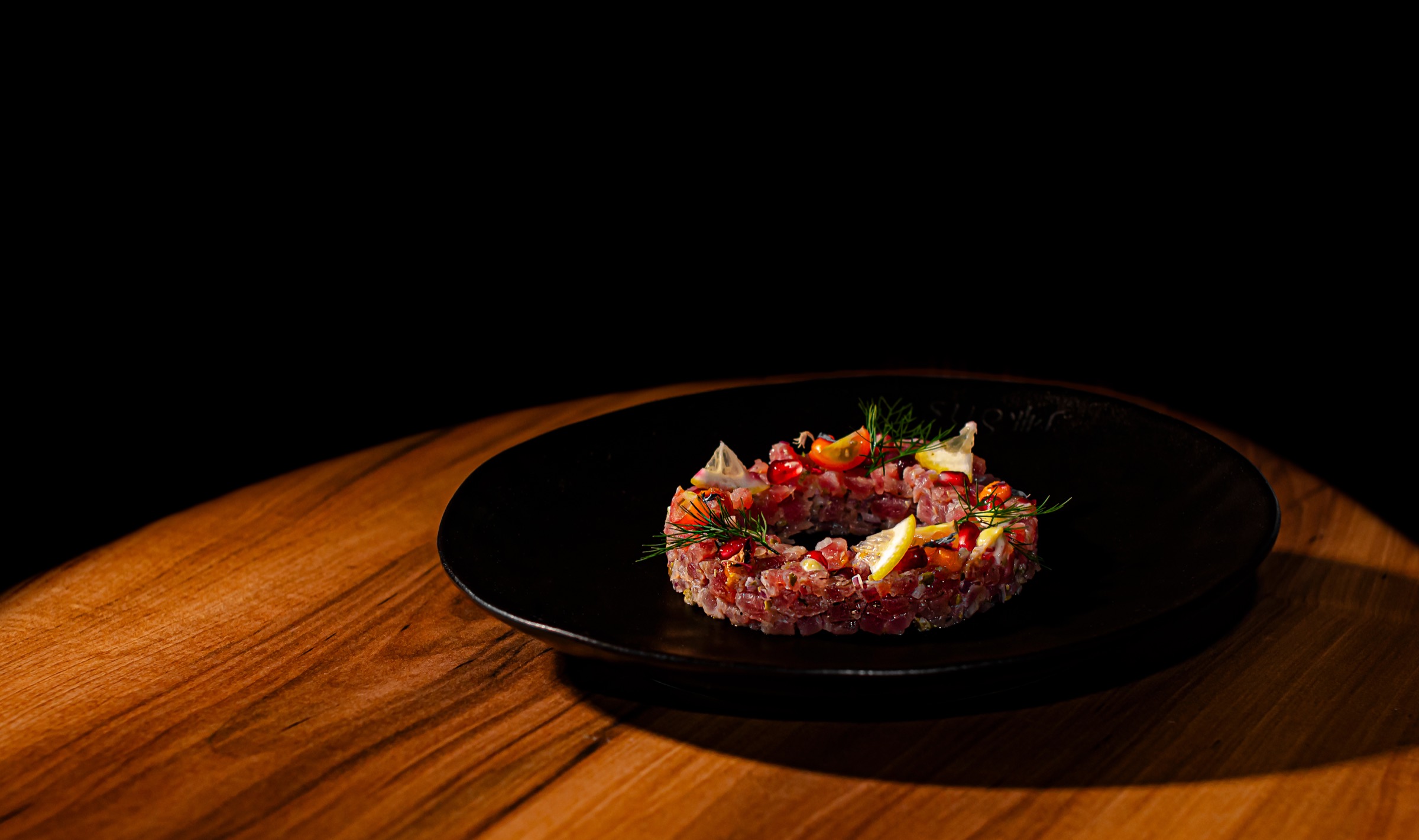 Tuna tartare on a dark plate